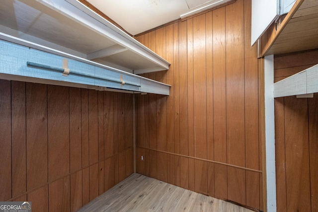 walk in closet featuring light hardwood / wood-style flooring