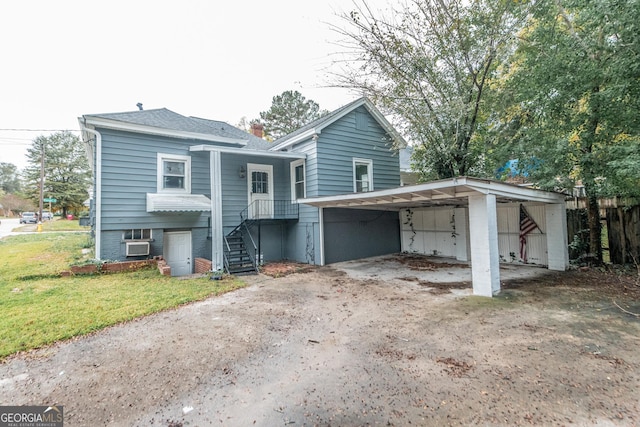 view of front facade featuring a carport and a front yard