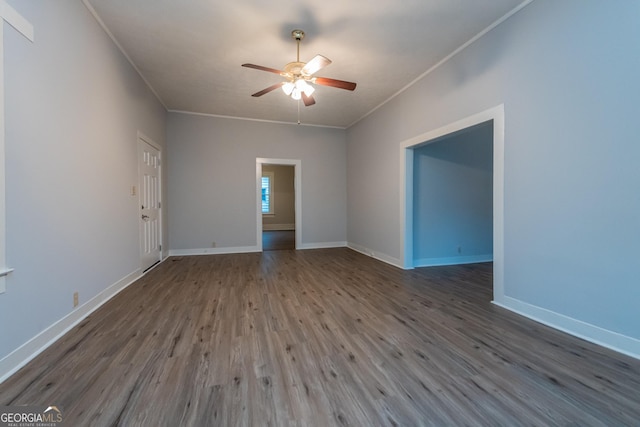 empty room featuring crown molding, ceiling fan, and wood-type flooring