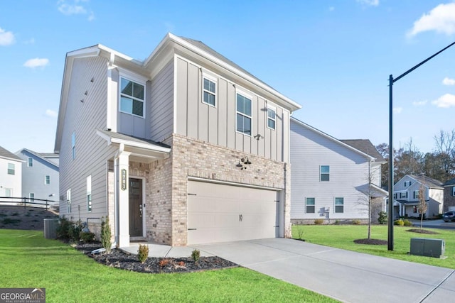 view of front facade with a front lawn, central AC unit, and a garage