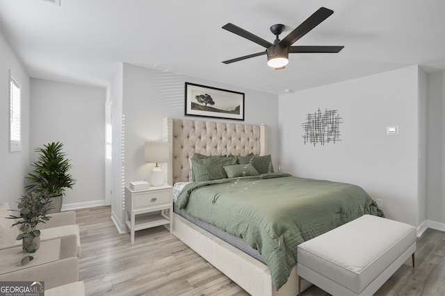 bedroom featuring hardwood / wood-style flooring and ceiling fan