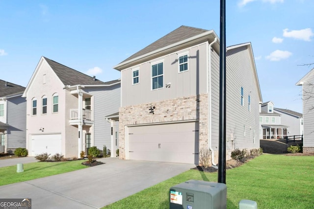 view of front of home with a front yard and a garage