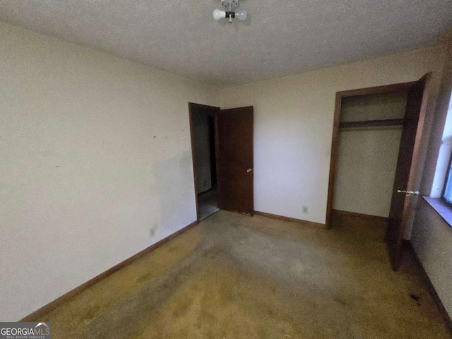 unfurnished bedroom with carpet and a closet