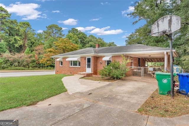 single story home with a front lawn and a carport