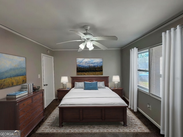 carpeted bedroom with ornamental molding and ceiling fan