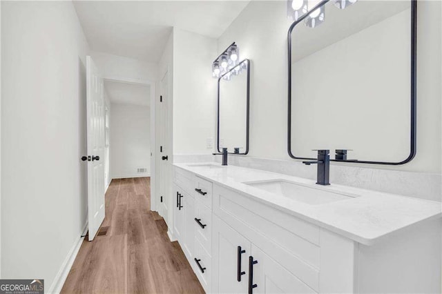 bathroom featuring hardwood / wood-style flooring and vanity