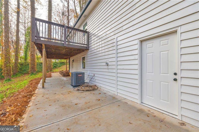 view of patio / terrace featuring central air condition unit and a deck