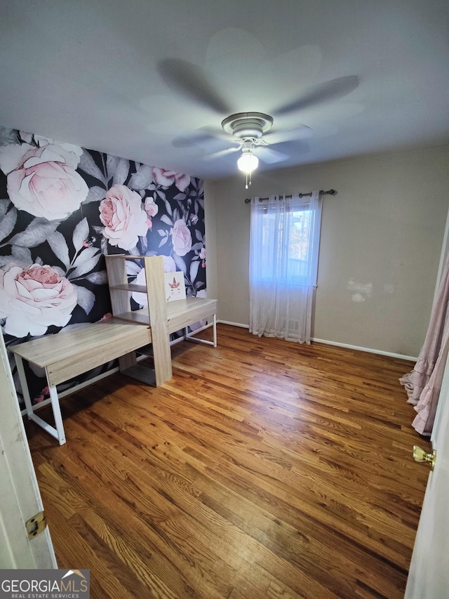 bedroom featuring ceiling fan and hardwood / wood-style floors