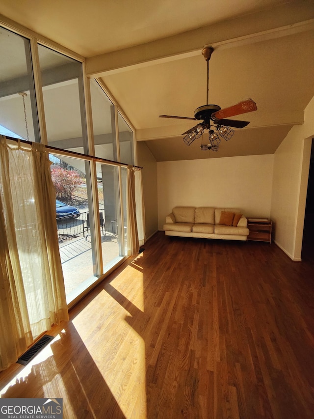 unfurnished living room with vaulted ceiling with beams, dark hardwood / wood-style flooring, and ceiling fan