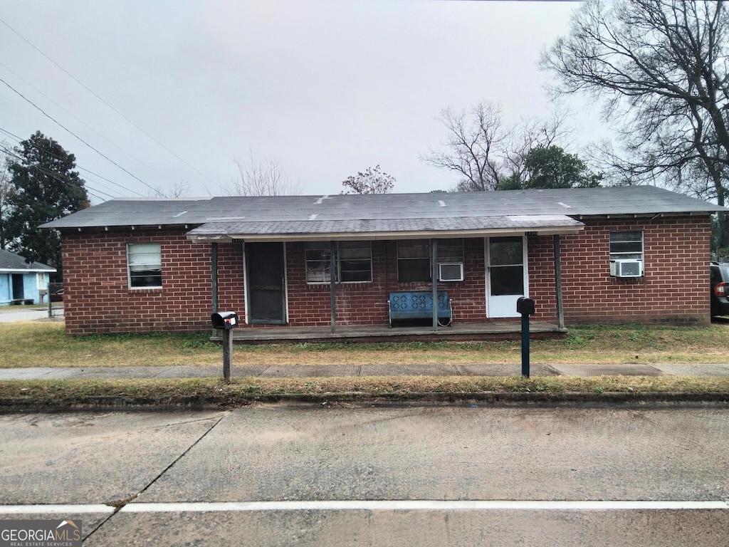 ranch-style home with cooling unit