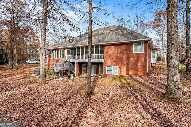 rear view of house with a sunroom