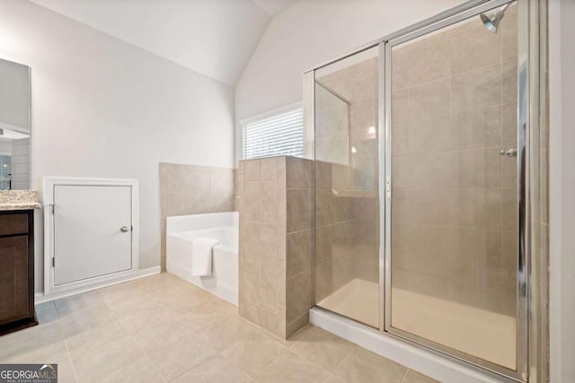 bathroom featuring tile patterned floors, vanity, independent shower and bath, and lofted ceiling