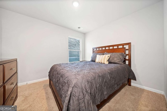 bedroom with light carpet