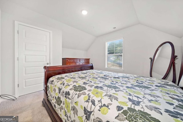 carpeted bedroom featuring vaulted ceiling