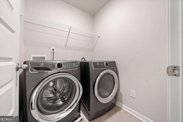 laundry room featuring independent washer and dryer