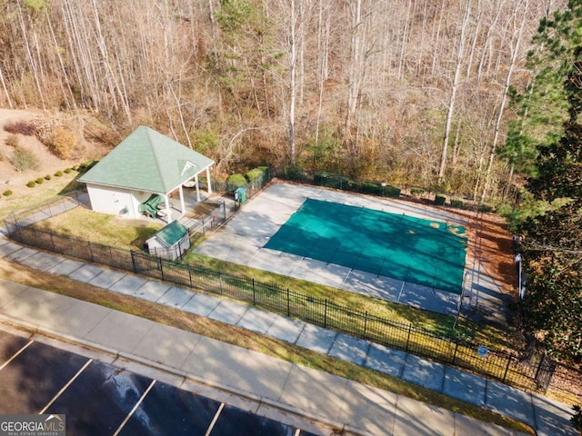 view of pool featuring a patio area and a yard