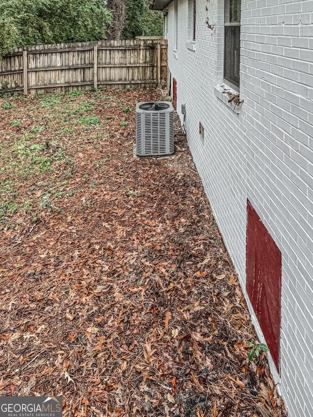 view of yard with central AC unit