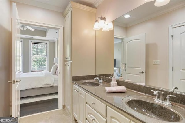 bathroom with tile patterned flooring, vanity, and ornamental molding