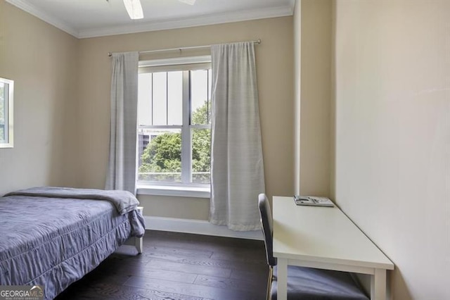 bedroom with baseboards, ornamental molding, ceiling fan, and hardwood / wood-style floors