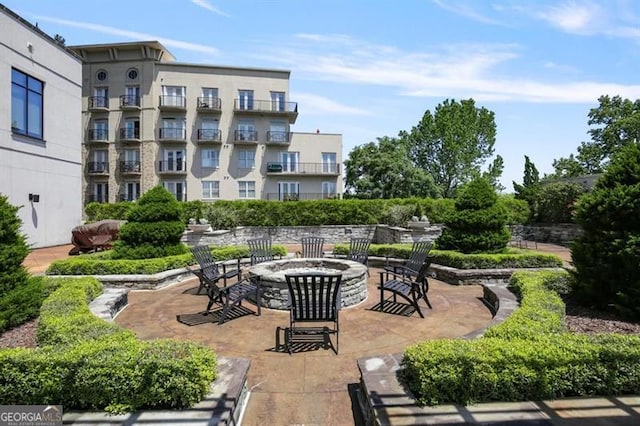 view of patio with an outdoor fire pit