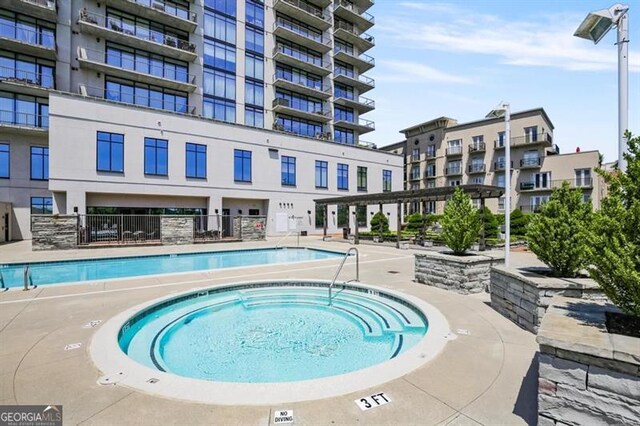 view of patio / terrace featuring an outdoor fire pit