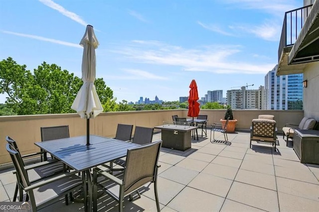 view of patio with a view of city, outdoor lounge area, and outdoor dining space