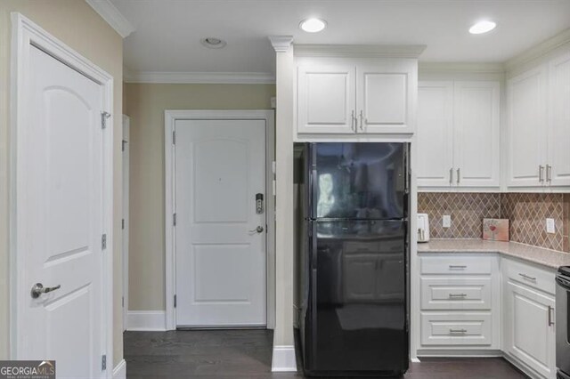 kitchen featuring crown molding, sink, white cabinetry, and stainless steel appliances