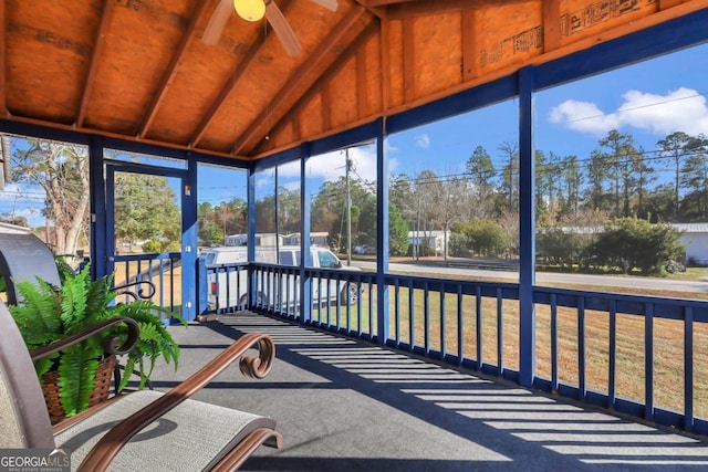 sunroom / solarium featuring ceiling fan and lofted ceiling