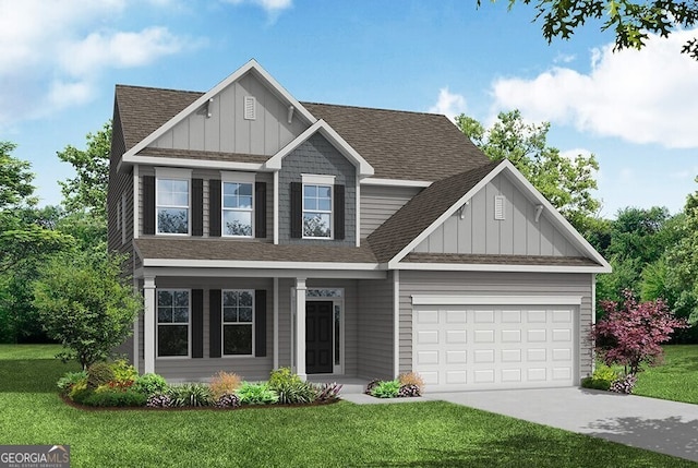 view of front of home with a front lawn and a garage