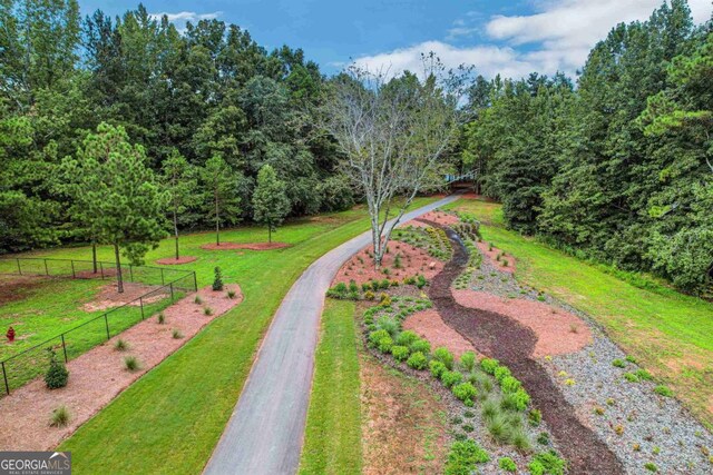 view of home's community featuring a yard