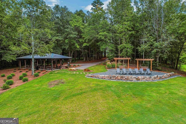 view of yard featuring a pergola and a gazebo