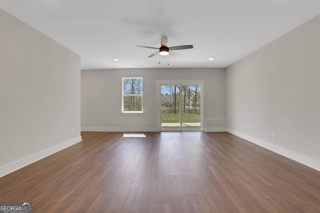 unfurnished room with baseboards, dark wood-type flooring, ceiling fan, and recessed lighting
