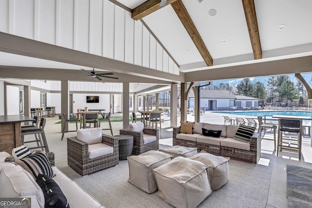 view of patio / terrace featuring ceiling fan, outdoor lounge area, outdoor dining space, and a community pool