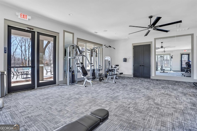 exercise room featuring carpet floors, ceiling fan, french doors, and visible vents