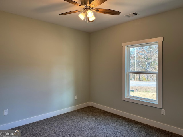 spare room with carpet floors and ceiling fan