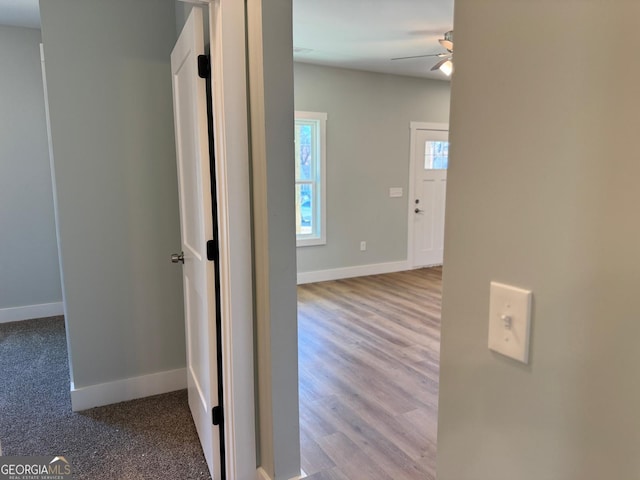 hallway with light hardwood / wood-style flooring