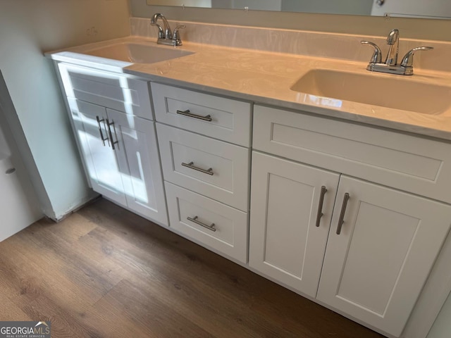 bathroom with vanity and hardwood / wood-style flooring