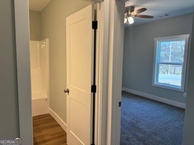 corridor with dark wood-type flooring