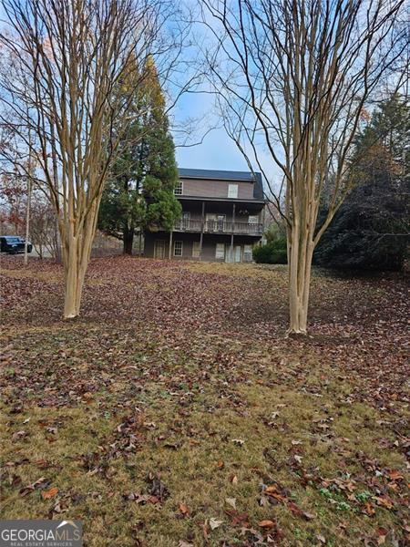 view of yard with a wooden deck