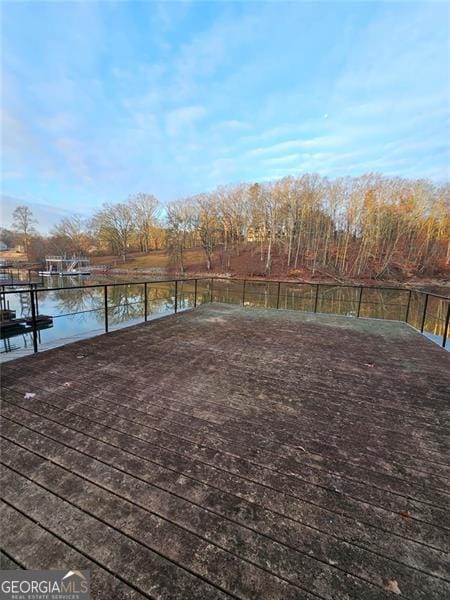 wooden terrace with a water view