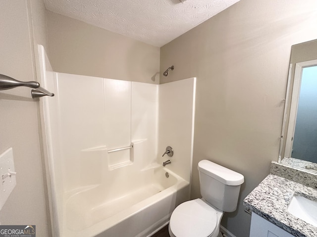 full bathroom with vanity, a textured ceiling, toilet, and  shower combination