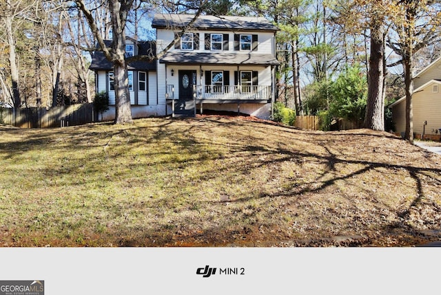 view of front facade featuring a front lawn and a porch