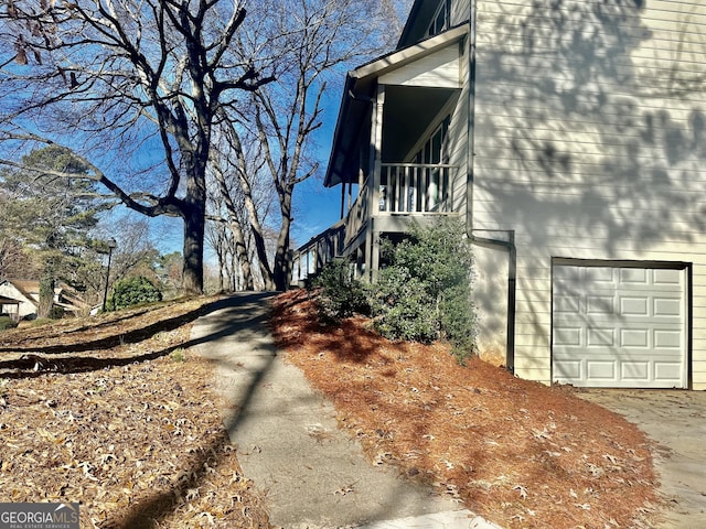 view of property exterior featuring a garage