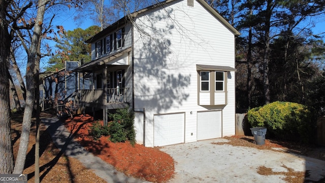 view of side of home featuring a garage