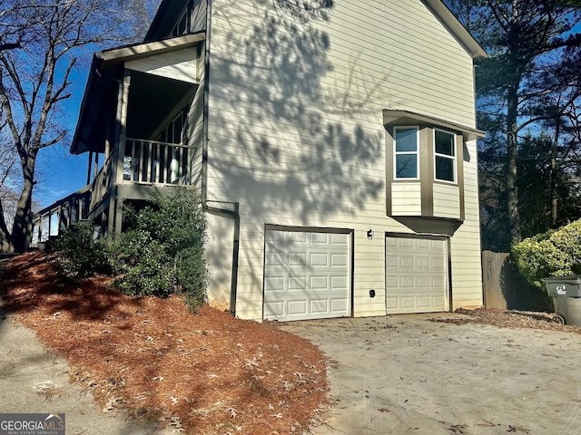 view of side of home featuring a garage