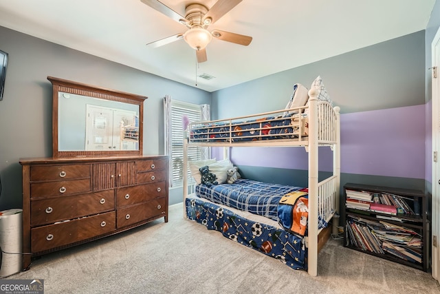 bedroom featuring ceiling fan and light colored carpet