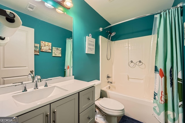 full bathroom featuring vanity, toilet, and shower / tub combo