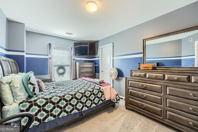 bedroom with light colored carpet