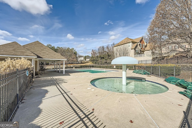 view of swimming pool with a patio area