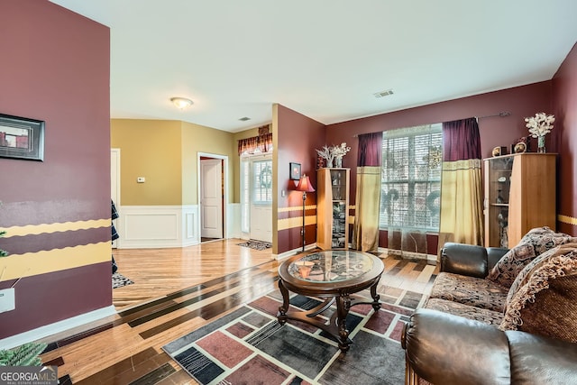 living room with plenty of natural light and wood-type flooring